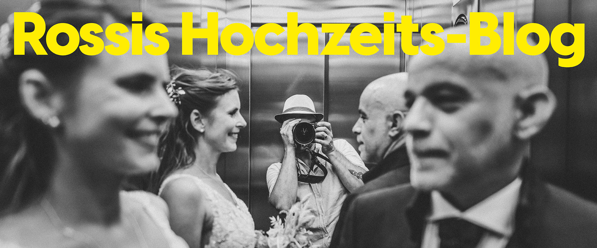 Rossi fotografiert eine Hochzeitsgesellschaft im Aufzug während einer Hochzeitsreportage, Beitragsbild für seinen Hochzeitsfotografie Blog